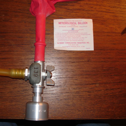 Photo of a Totex 30 gram meteorological balloon on a nozzle