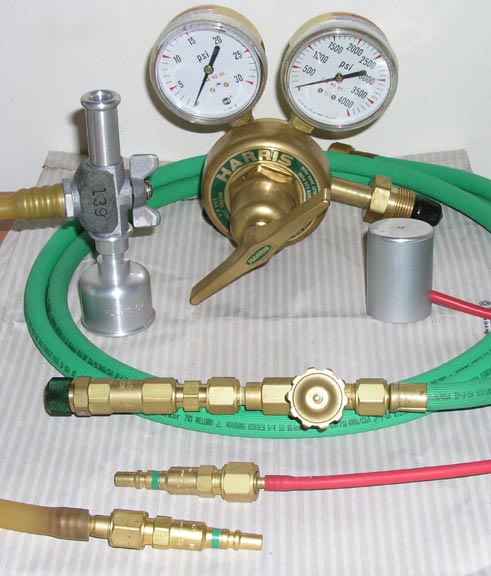 image of Pilot Balloon inflation equipment.  Regulator, 10 gm Nozzle, 30/100 gm nozzle, hose, quick releas gas fittings.