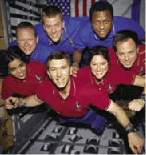 [ photograph of the Columbia crew, weightless during STS-107 ]