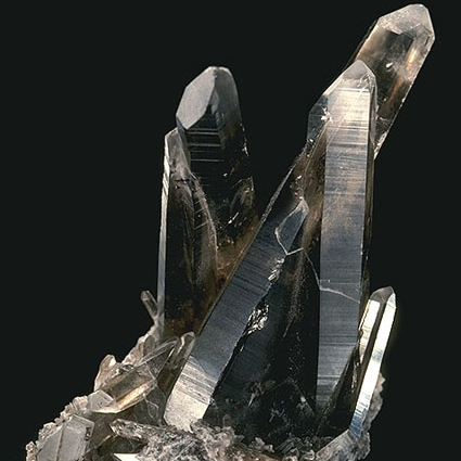 [ smoky quartz cluster, Wikipedia, modified by C.M. Rodrigue ]
